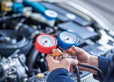 Technician repairing air conditioning-Auto Mechanical repair Dingmans Mechanical repair